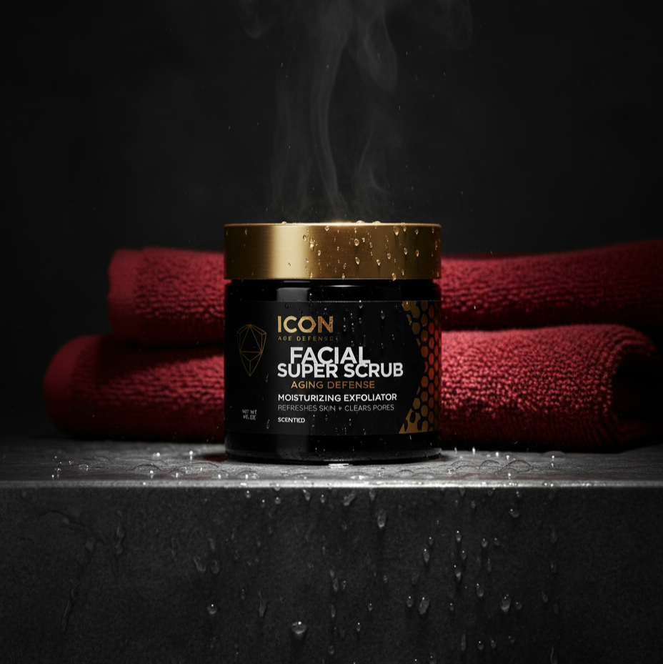 Icon Facial Super Scrub jar with gold lid on a dark surface with red towels in the background